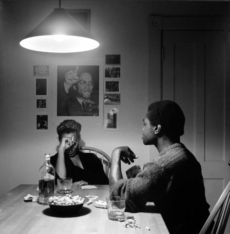 Carrie Mae Weems, Untitled (Playing Cards/Malcolm X) from the Kitchen Table II series, 1990, printed 1999, gelatin silver print, edition 2/5, 26 ¾ × 26 ⅞ inches. Museum purchase with funds provided by 2004 Collectors' Circle, 2004.24.04.91. © Carrie Mae Weems.