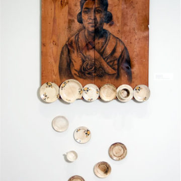 Whitfield Lovell, One of These Days, 2006, charcoal and china on wood, 84 × 37 × 4 ½ inches. Museum purchase with funds provided by 2007 Collectors’ Circle with additional funds provided by Phillip Broughton & David Smith, 2007.33.01.29. © Whitfield Lovell