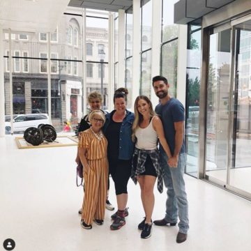 Megan and Kyle touring the Museum with family and Shea Brown.