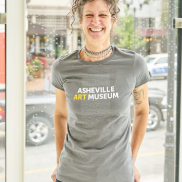 Woman modeling museum t-shirt