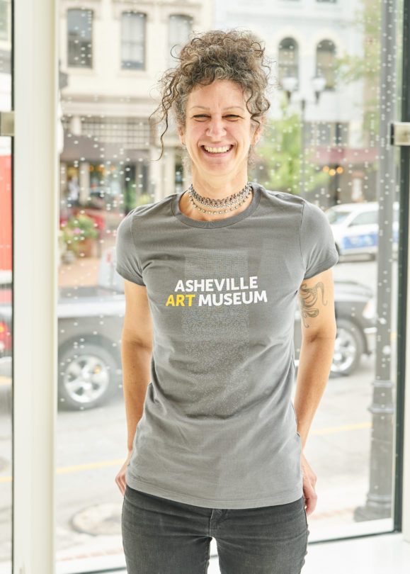 Woman modeling museum t-shirt