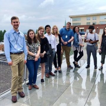 Carl Sukow (left) tours the Museum with his fellow summer interns.