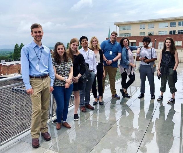 Carl Sukow (left) tours the Museum with his fellow summer interns.