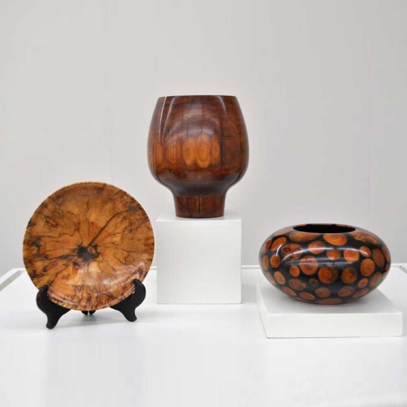 Wood carvings featured in the exhibition.